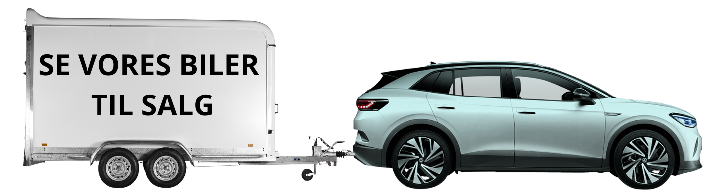 en VW bil som har en trailer bagpå hvor der står "se vores biler til salg"